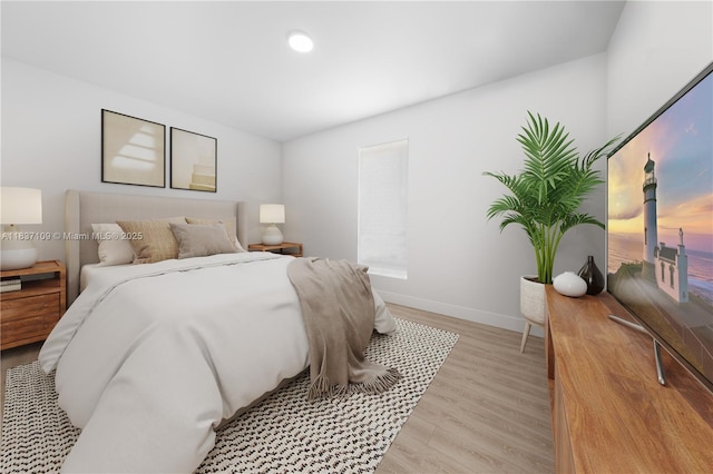11128NW 17th Ave Unit 1-2, Miami, FL 33167 - bedroom featuring light wood-style flooring and baseboards