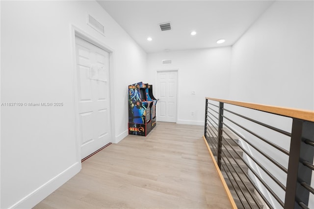 11128NW 17th Ave Unit 1-2, Miami, FL 33167 - corridor featuring recessed lighting, light wood finished floors, and an upstairs landing