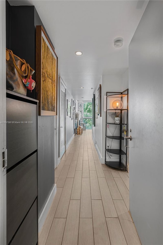 720 NE 62nd St Unit 301, Miami, FL 33138 - hall featuring wood finish floors and recessed lighting