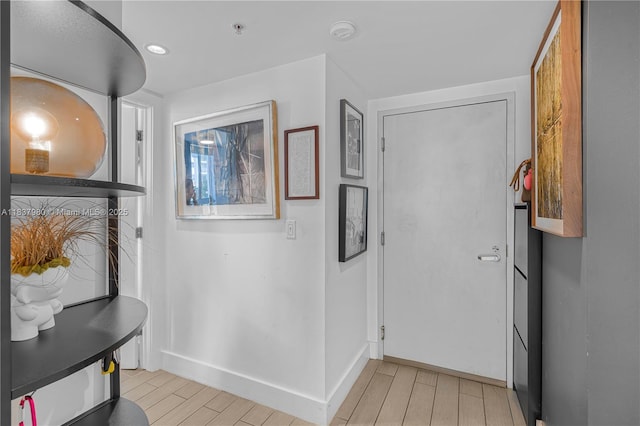 720 NE 62nd St Unit 301, Miami, FL 33138 - hallway featuring light wood finished floors and recessed lighting