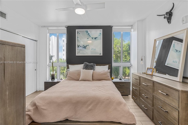 720 NE 62nd St Unit 301, Miami, FL 33138 - bedroom with multiple windows and ceiling fan