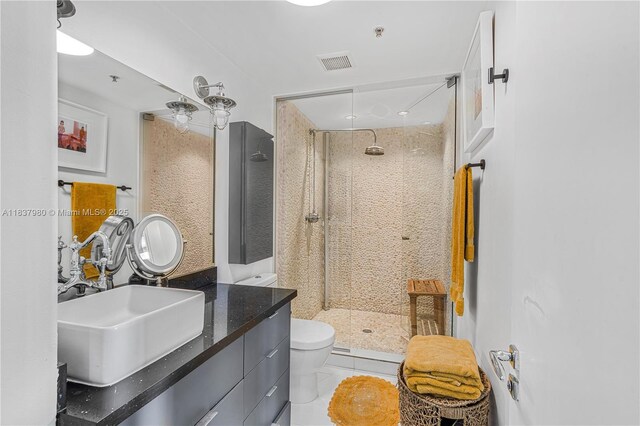 720 NE 62nd St Unit 301, Miami, FL 33138 - bathroom featuring double vanity and a shower stall