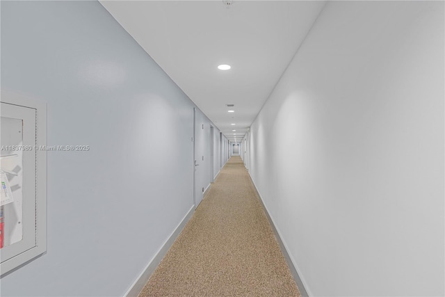 720 NE 62nd St Unit 301, Miami, FL 33138 - hallway featuring baseboards and recessed lighting