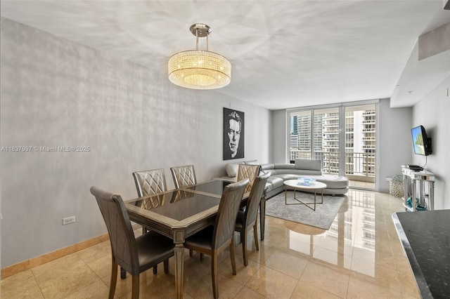 801 Brickell Key Blvd Unit 2006, Miami, FL 33131 - dining room featuring floor to ceiling windows and light tile patterned flooring