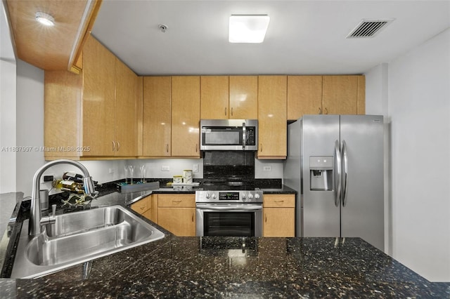 801 Brickell Key Blvd Unit 2006, Miami, FL 33131 - kitchen with stainless steel appliances and dark countertops