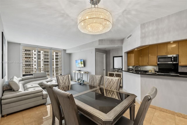801 Brickell Key Blvd Unit 2006, Miami, FL 33131 - dining room featuring a chandelier and light tile patterned flooring