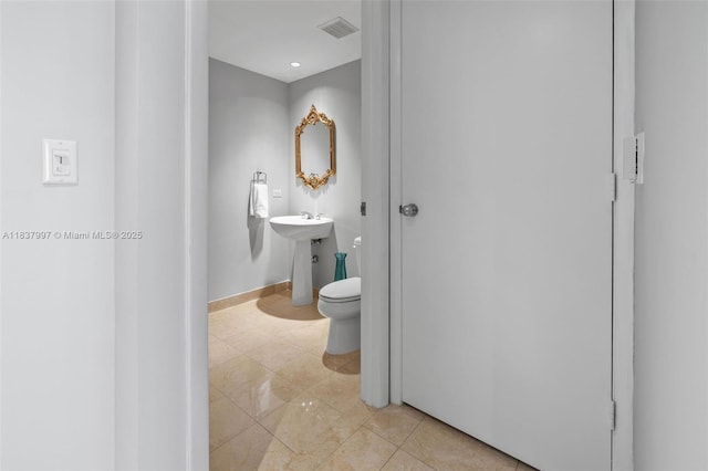 801 Brickell Key Blvd Unit 2006, Miami, FL 33131 - half bath with toilet and tile patterned flooring