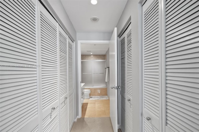 801 Brickell Key Blvd Unit 2006, Miami, FL 33131 - hall with light tile patterned flooring and light colored carpet