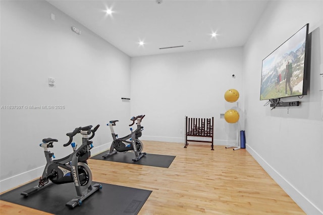 801 Brickell Key Blvd Unit 2006, Miami, FL 33131 - workout area with wood finished floors and recessed lighting