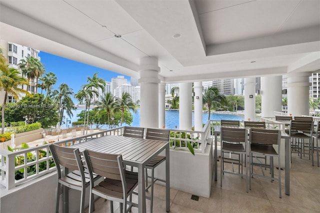 801 Brickell Key Blvd Unit 2006, Miami, FL 33131 - view of patio featuring a water view and outdoor dining area