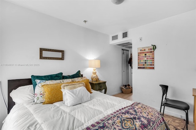 1450 Meridian Ave Unit 202, Miami Beach, FL 33139 - bedroom featuring baseboards and wood finished floors