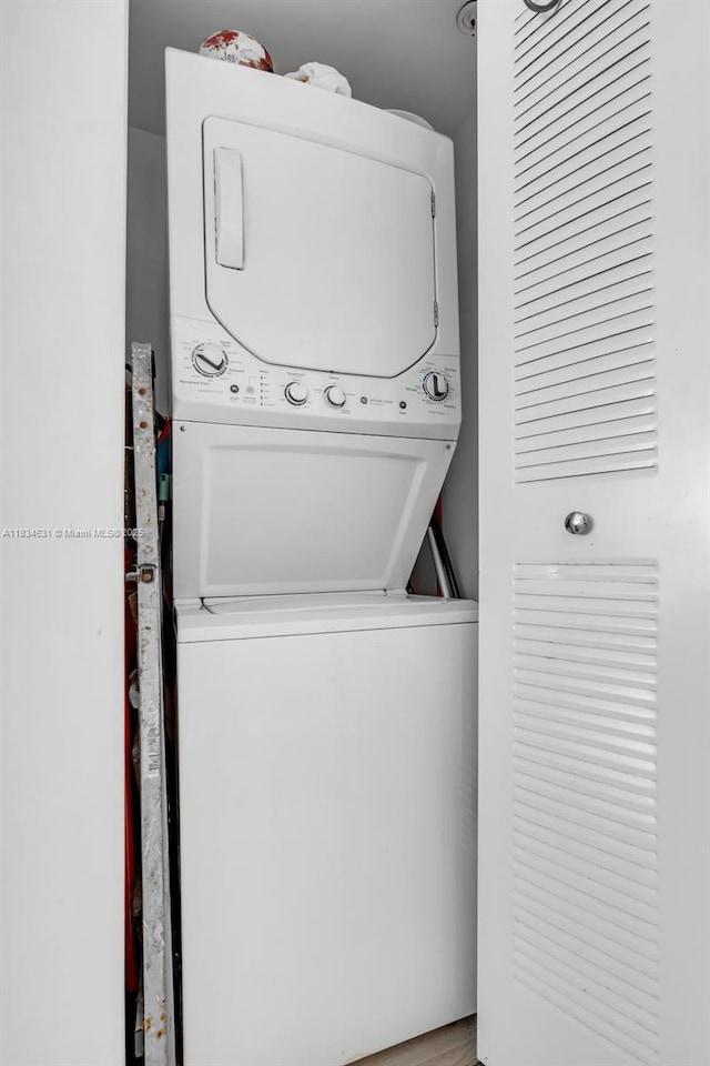 1450 Meridian Ave Unit 202, Miami Beach, FL 33139 - laundry area featuring estacked washer and dryer