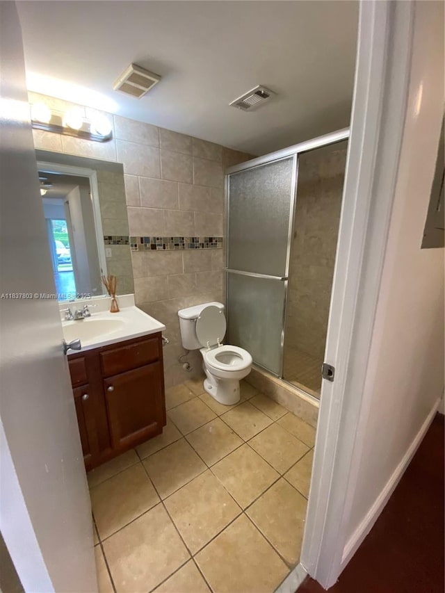 7640 Westwood Dr Unit 406, Tamarac, FL 33321 - full bathroom featuring tile patterned floors, vanity, a shower stall, and tile walls