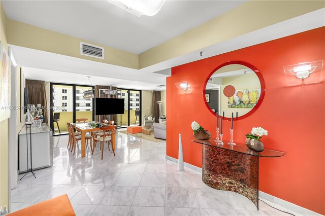 1623 Collins Ave Unit Ph1010, Miami Beach, FL 33139 - dining room with marble finish flooring and baseboards