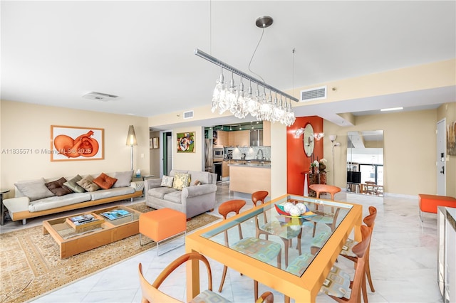 1623 Collins Ave Unit Ph1010, Miami Beach, FL 33139 - dining space featuring light marble finish flooring