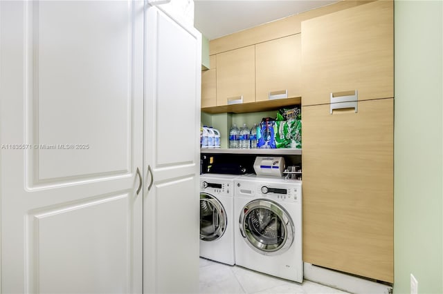 1623 Collins Ave Unit Ph1010, Miami Beach, FL 33139 - laundry room with washing machine and dryer and light tile patterned flooring