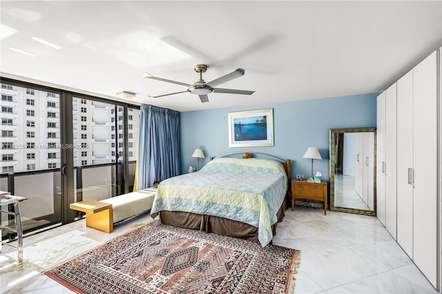 1623 Collins Ave Unit Ph1010, Miami Beach, FL 33139 - bedroom with light marble finish flooring and a ceiling fan