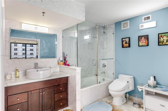 1623 Collins Ave Unit Ph1010, Miami Beach, FL 33139 - full bath featuring vanity, tiled shower / bath combo, and decorative backsplash