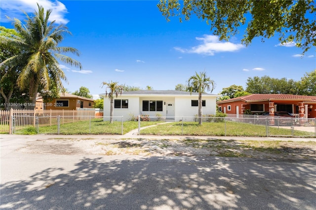 775 NE 145th St, North Miami, FL 33161 - ranch-style home with stucco siding and a fenced front yard
