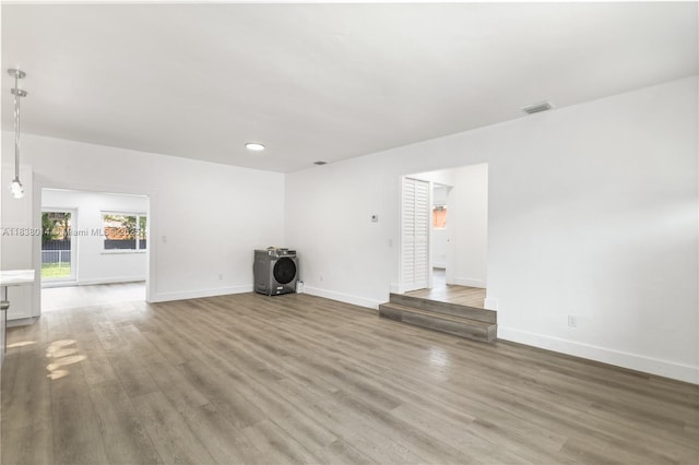 775 NE 145th St, North Miami, FL 33161 - unfurnished living room featuring wood finished floors and recessed lighting