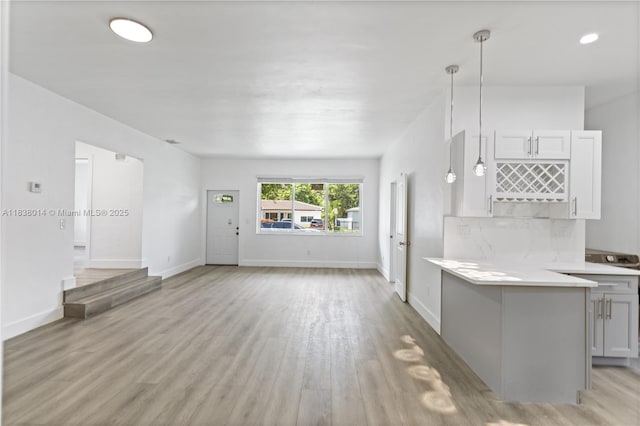 775 NE 145th St, North Miami, FL 33161 - unfurnished living room featuring light wood finished floors and baseboards
