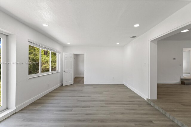 775 NE 145th St, North Miami, FL 33161 - unfurnished room with recessed lighting and light wood-style flooring