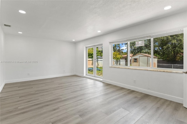 775 NE 145th St, North Miami, FL 33161 - spare room featuring recessed lighting and light wood-style flooring