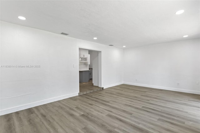 775 NE 145th St, North Miami, FL 33161 - spare room featuring recessed lighting and wood finished floors