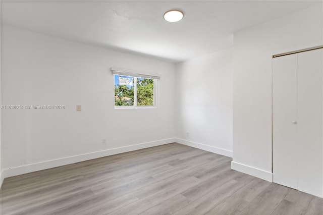 775 NE 145th St, North Miami, FL 33161 - empty room featuring light wood finished floors
