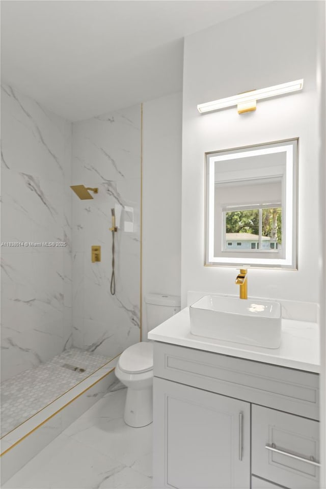 775 NE 145th St, North Miami, FL 33161 - bathroom featuring marble look tile flooring, vanity, and a marble finish shower