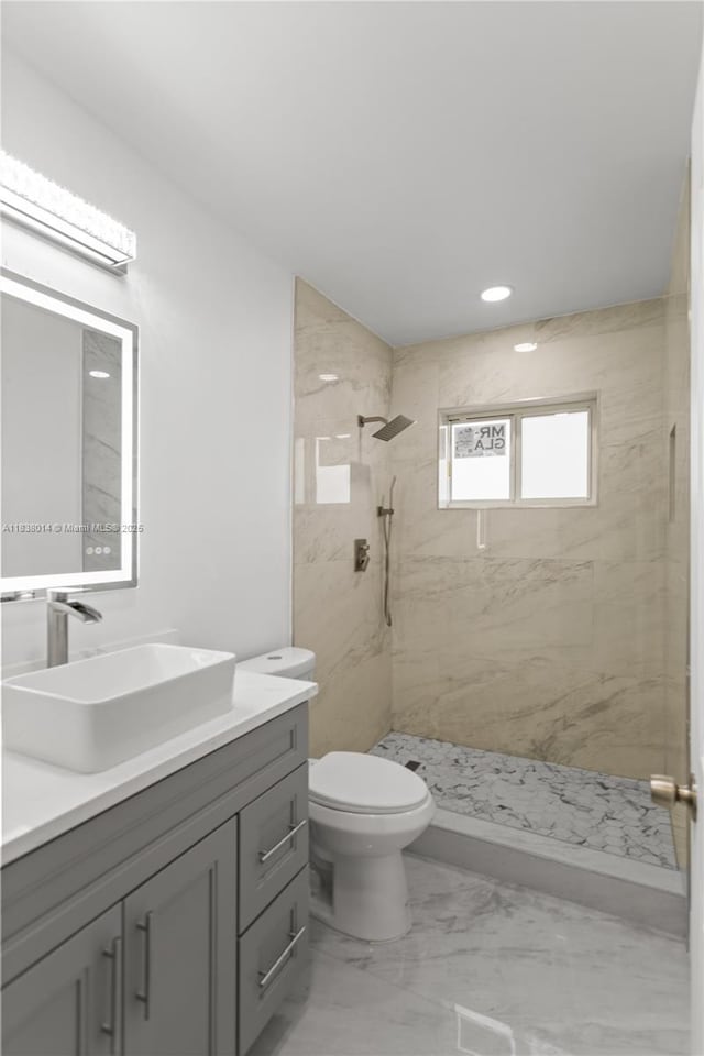 775 NE 145th St, North Miami, FL 33161 - bathroom with vanity, a marble finish shower, recessed lighting, and marble finish flooring
