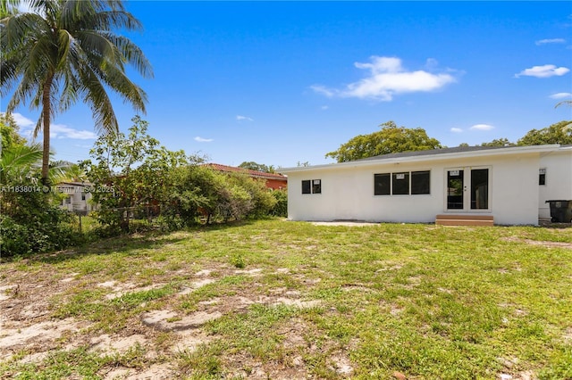 775 NE 145th St, North Miami, FL 33161 - view of yard with entry steps and french doors