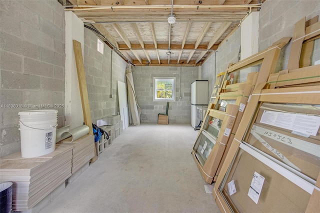547 Heck, Little Torch Key, FL 33042 - below grade area featuring freestanding refrigerator and concrete block wall