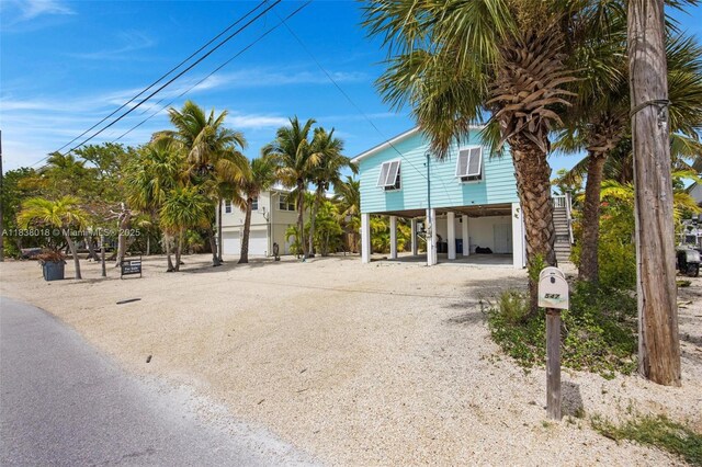 547 Heck, Little Torch Key, FL 33042 - view of front of property with a carport and dirt driveway