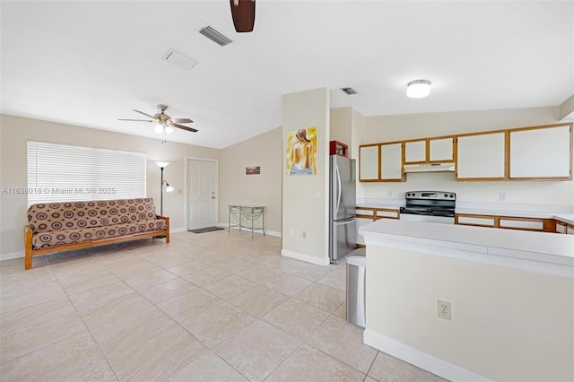 547 Heck, Little Torch Key, FL 33042 - kitchen featuring appliances with stainless steel finishes, ceiling fan, under cabinet range hood, light countertops, and light tile patterned floors
