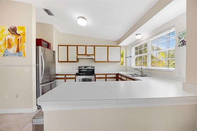 547 Heck, Little Torch Key, FL 33042 - kitchen with appliances with stainless steel finishes, under cabinet range hood, vaulted ceiling, a peninsula, and light countertops