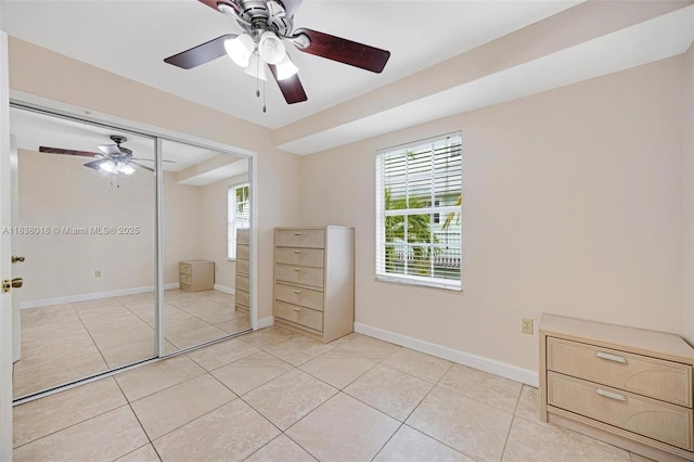 547 Heck, Little Torch Key, FL 33042 - unfurnished bedroom with multiple windows, light tile patterned flooring, a closet, and a ceiling fan