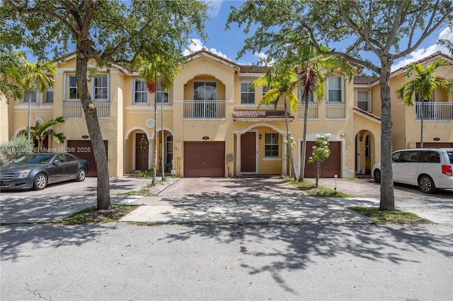 15057 SW 9th Ter, Miami, FL 33194 - multi unit property featuring a balcony, an attached garage, a tiled roof, stucco siding, and concrete driveway