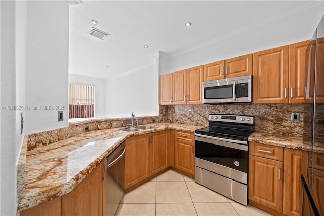 15057 SW 9th Ter, Miami, FL 33194 - kitchen with stainless steel appliances, ornamental molding, light stone counters, light tile patterned floors, and backsplash