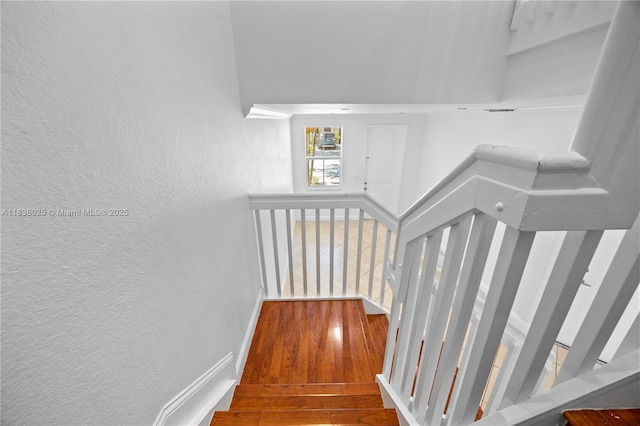 15057 SW 9th Ter, Miami, FL 33194 - stairs featuring a textured wall and hardwood / wood-style floors