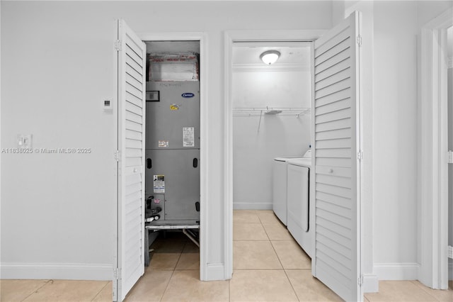 15057 SW 9th Ter, Miami, FL 33194 - laundry area with washer and dryer, light tile patterned floors, and heating unit