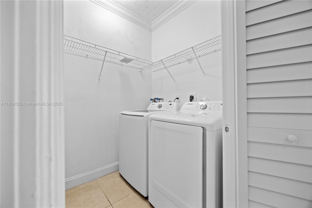 15057 SW 9th Ter, Miami, FL 33194 - washroom with crown molding, washing machine and clothes dryer, and light tile patterned flooring