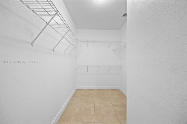 15057 SW 9th Ter, Miami, FL 33194 - spacious closet with light tile patterned floors