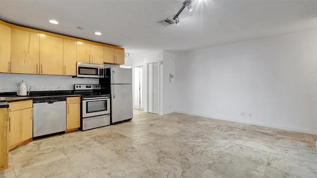 1348 Holly Heights Dr Unit 17, Fort Lauderdale, FL 33304 - kitchen featuring appliances with stainless steel finishes, dark countertops, light brown cabinets, and recessed lighting
