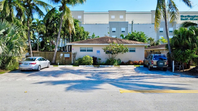 1348 Holly Heights Dr Unit 17, Fort Lauderdale, FL 33304 - view of front of house featuring uncovered parking and stucco siding
