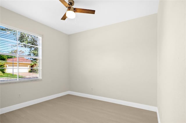 798 Quartz Ter, Palm Beach, FL 33413 - spare room with light wood finished floors and a ceiling fan