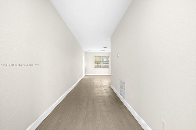 798 Quartz Ter, Palm Beach, FL 33413 - corridor with baseboards and wood finished floors