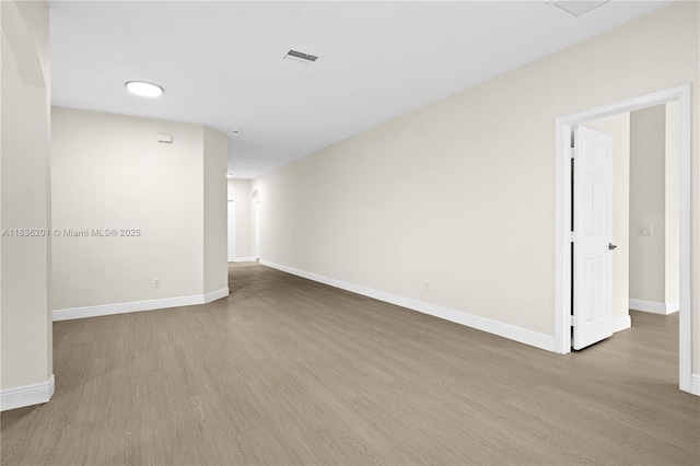 798 Quartz Ter, Palm Beach, FL 33413 - spare room featuring wood finished floors and baseboards