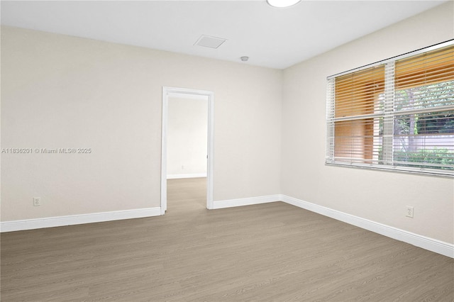 798 Quartz Ter, Palm Beach, FL 33413 - unfurnished room with wood finished floors and baseboards