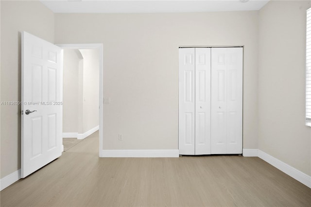 798 Quartz Ter, Palm Beach, FL 33413 - unfurnished bedroom featuring light wood-type flooring and a closet